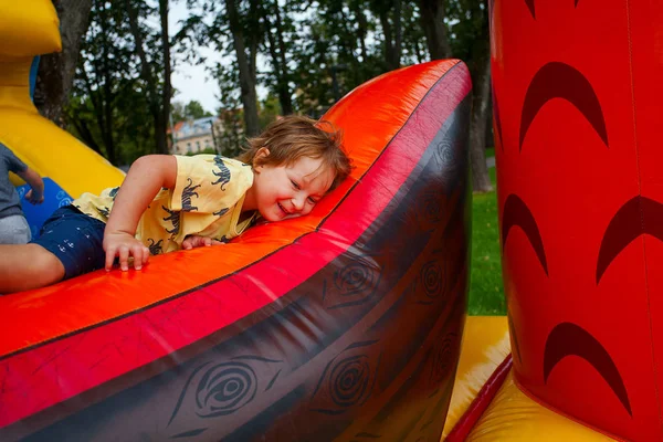 cute child on a colorful trampoline in park