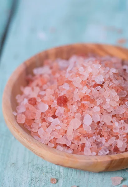 Himalayan Salt on turquoise wooden surface