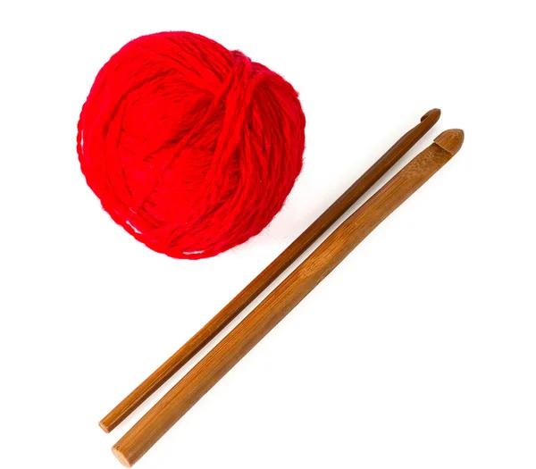 Crochet hook and red ball of yarn — Stock Photo, Image