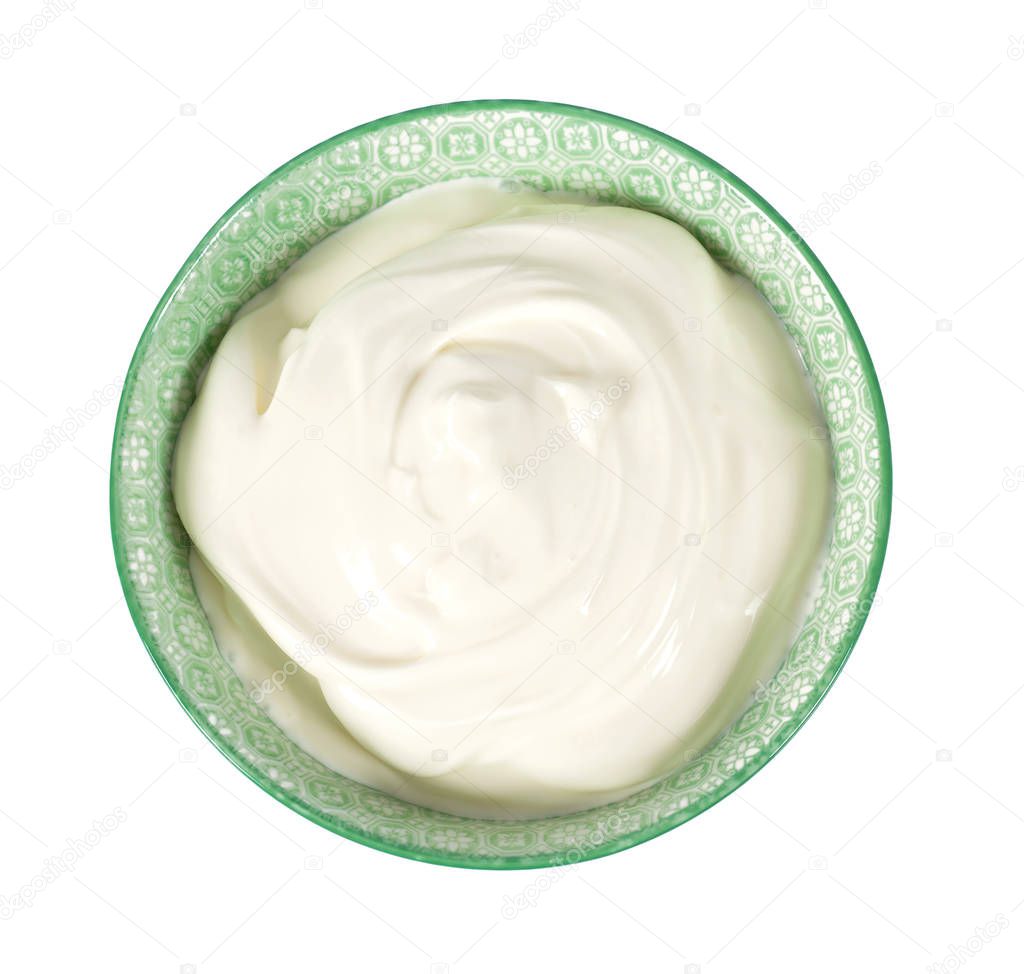 sour cream in a bowl isolated on white