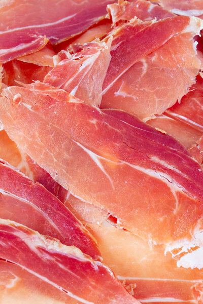 spanish jamon serrano isolated on white