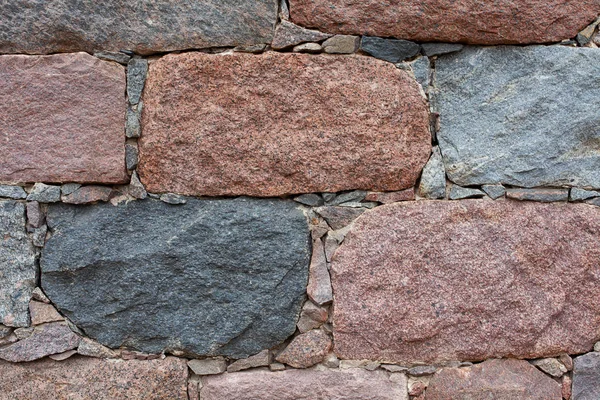 Färgglada stenväggar noggrant staplade — Stockfoto