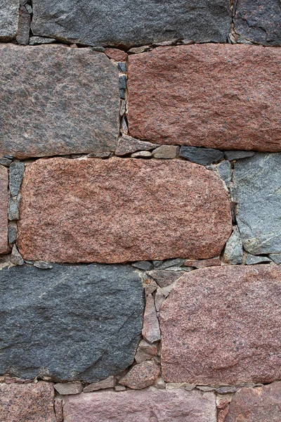 Parede de pedra colorida cuidadosamente empilhados — Fotografia de Stock