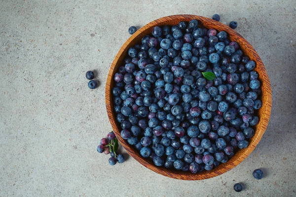 Fres blueberries in a bowl on granite surface — Stock Photo, Image
