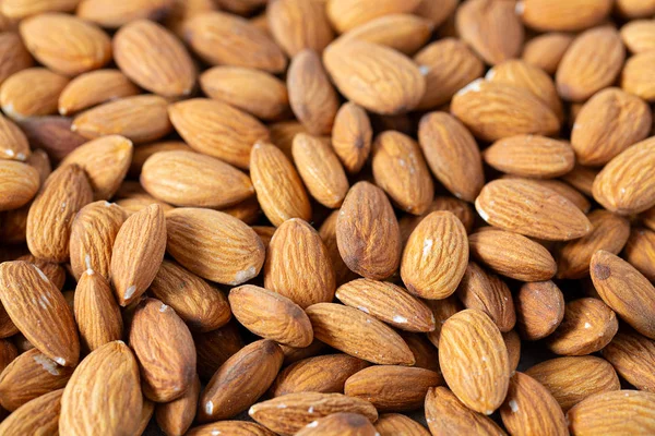 Almond nut background, macro shot — Stock Photo, Image