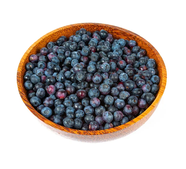 Fresh blueberries in a wooden bowl — Stock Photo, Image