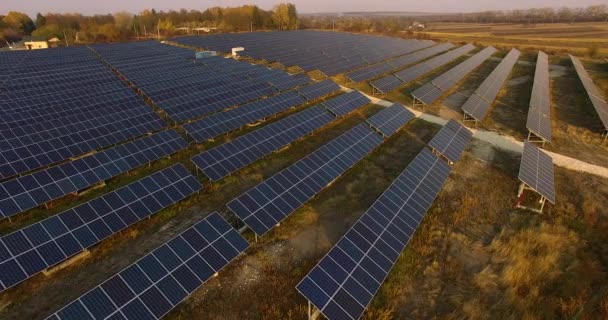 Aerial View. Flying over the solar power plant with sun. Solar panels and sun. Aerial drone shot. 4K ProRes HQ Ukraine — Stock Video