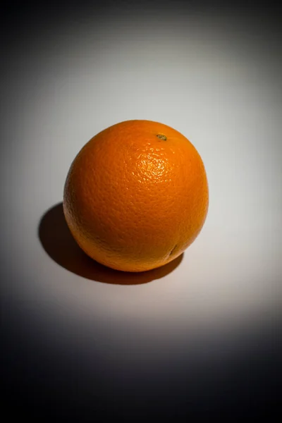 Ripe orange on a white background