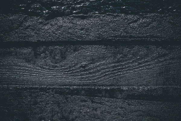 Black resin wall texture with scratches and cracks.