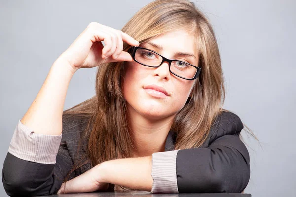 Woman in jacket with glasses in the office — Stock Photo, Image