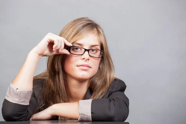 Woman in jacket with glasses in the office — Stock Photo, Image