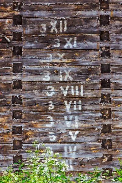 Wooden Wall Written Arabic Roman Numbers Logs Order — Stock Photo, Image