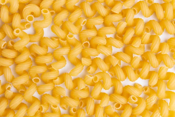 Primo piano dello sfondo secco di pasta cruda cellentani — Foto Stock