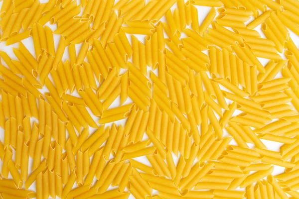 Italiano penne rigate macarrones pasta crudo alimentos fondo — Foto de Stock