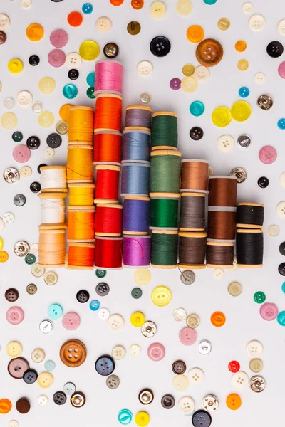 Spool of sewing threads and buttons different colors and types — Stock Photo, Image