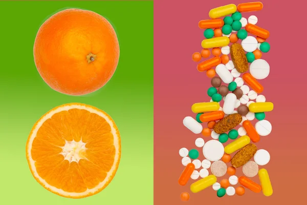 drug pills on red, whole and sliced orange on green