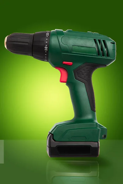 Cordless Battery Powered Green Drill Red Buttons Gradient Green Background — Stock Photo, Image