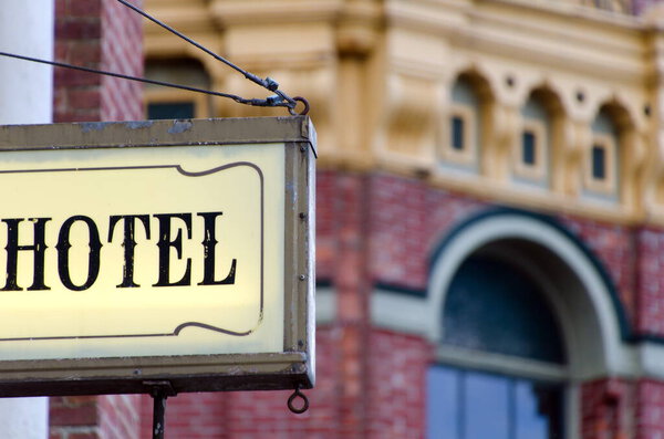 Hotel sign in Port Townsend historic district wil brick building in the background, Jefferson County, Washington