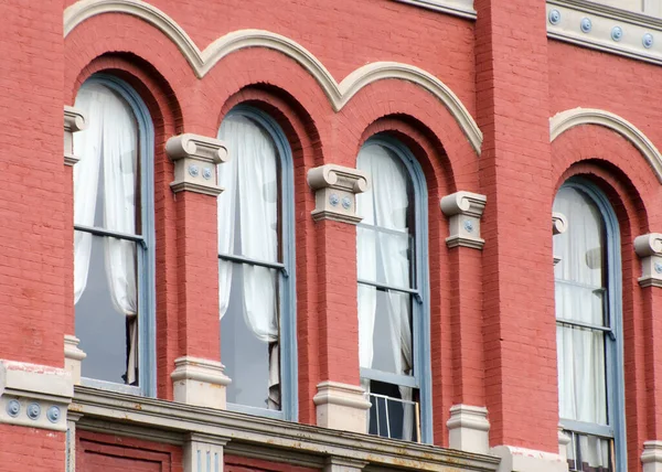 Rich exterior details of red Victorian building in Port Townsend downtown