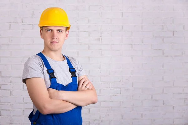 Portrait Young Handsome Man Blue Builder Uniform White Brick Wall — Stock Photo, Image