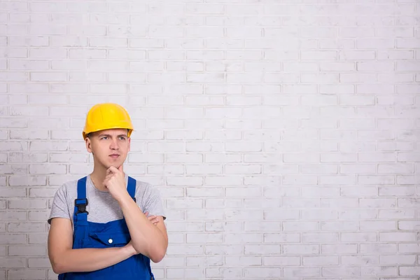 Thinking Builder Uniform Copy Space White Brick Wall — Stock Photo, Image