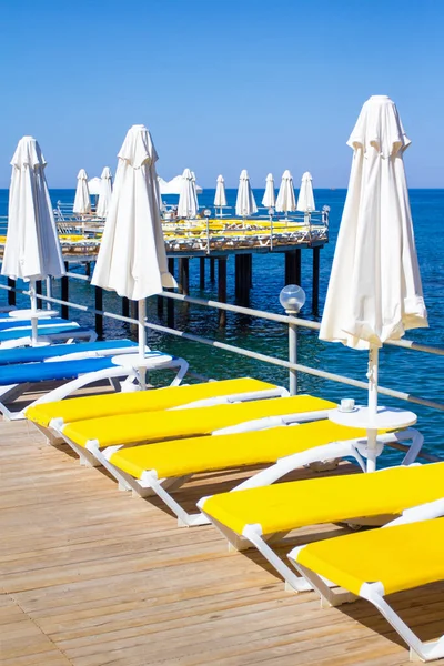 Travel Background Wooden Pier Chairs Umbrellas Blue Sea — Stock Photo, Image