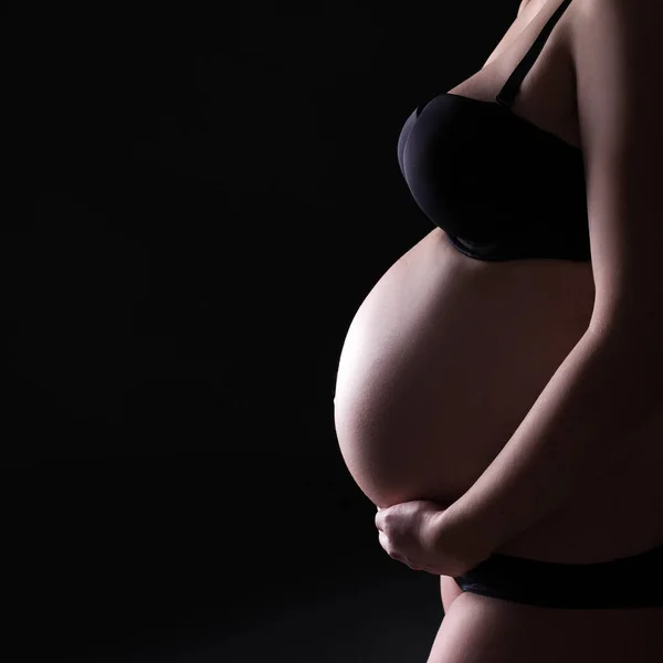 Close Pregnant Belly Copy Space Black Background — Stock Photo, Image