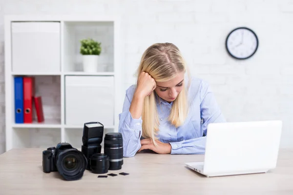 no idea - sad female photographer with camera, computer and photography equipment