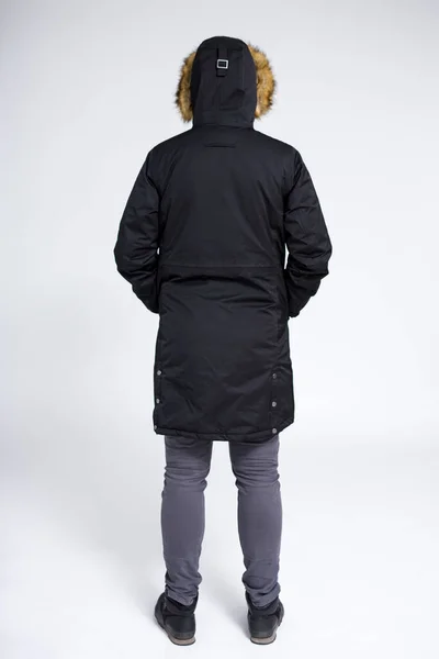 Visão Traseira Homem Posando Jaqueta Inverno Quente Sobre Fundo Cinza — Fotografia de Stock