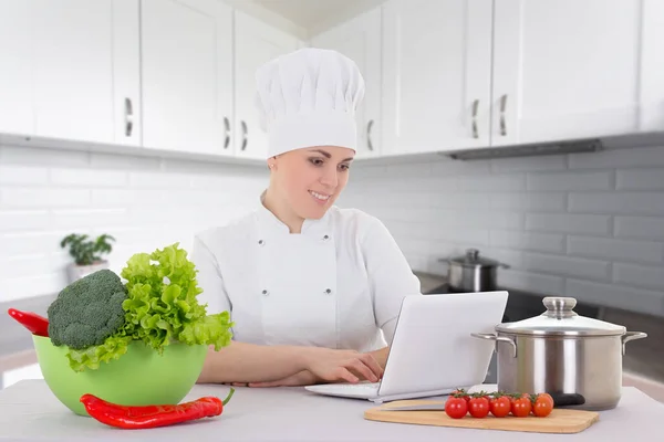 Portrait Attractive Cook Woman Uniform Sitting Kitchen Laptop — Stock Photo, Image