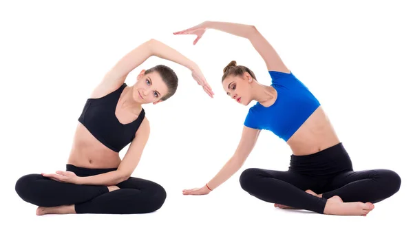 Twee Jonge Mooie Vrouwen Doen Stretching Oefeningen Geïsoleerd Witte Achtergrond — Stockfoto