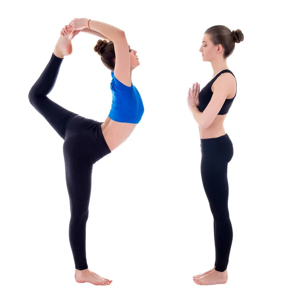 Sidovy Två Unga Smala Kvinnor Som Gör Yoga Isolerad Vit — Stockfoto