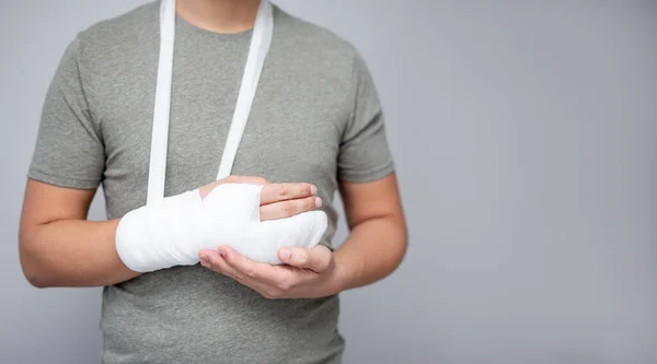 First Aid Concept Young Man Bandage Gypsum His Broken Hand — Stock Photo, Image