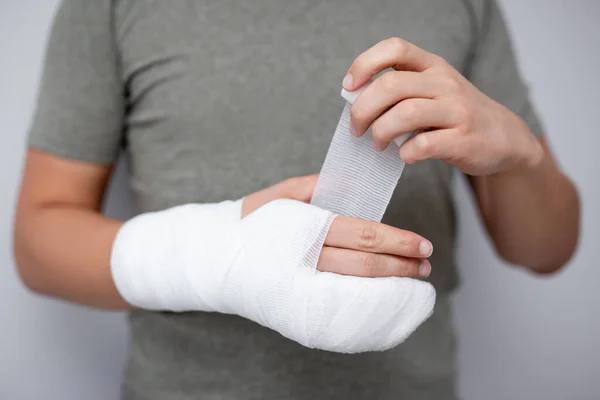 Fracture First Aid Concept Close Young Man Bandaging His Hand — Stock Photo, Image
