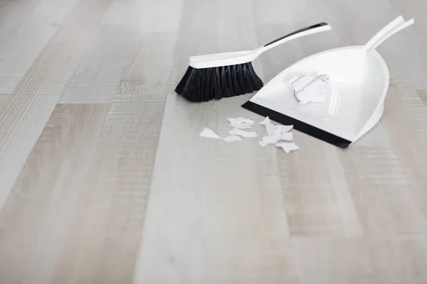 Close Scoop Brush Ripped Pieces Paper Copy Space Wooden Floor — Stock Photo, Image
