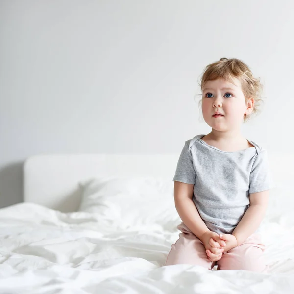 Cute Little Girl Sitting Bed Dreaming Thinking Something Copy Space — Stock Photo, Image