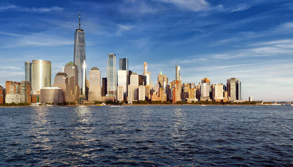 Panorama New York City with Manhattan Skyline over Hudson River on sunset.
