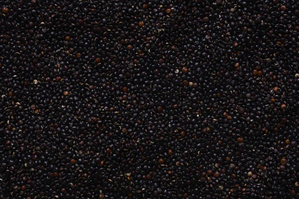 Arka plan olarak ham kuru siyah quinoa — Stok fotoğraf