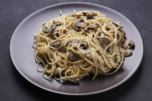 Plate of pasta with champignon — Stock Photo, Image