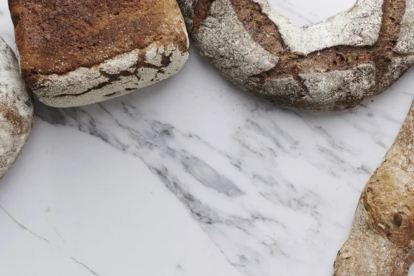 Verios bread on marble background — Stock Photo, Image