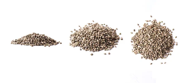 Beyaz arkaplanda yalıtılmış kenevir tohumları — Stok fotoğraf