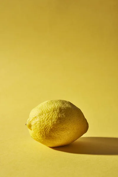 Lemon on yellow background — Stock Photo, Image