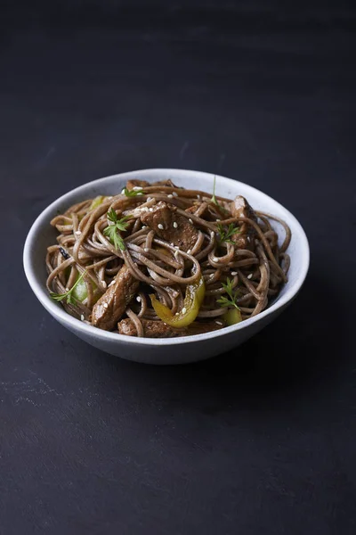 Fried pork with soba in asian style — Stock Photo, Image