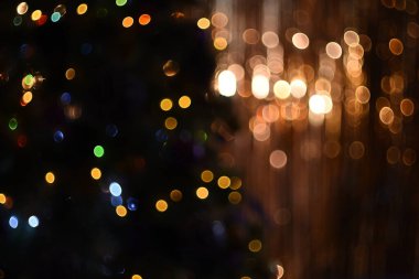 Arkaplan dokusu parlak çok renkli parlayan ışıklarla altın ve koyu yeşil arka planda bohçalanır