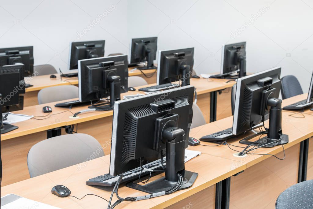 Empty computer room neatly placed for student.