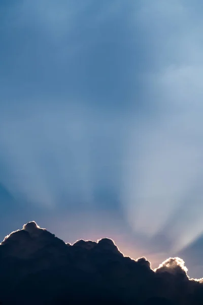 Sun rays through clouds like an dramatic explosion , power natur