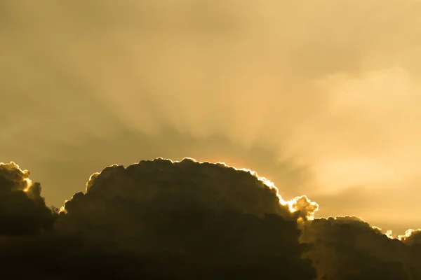 Sun rays through clouds like an dramatic explosion , power natur