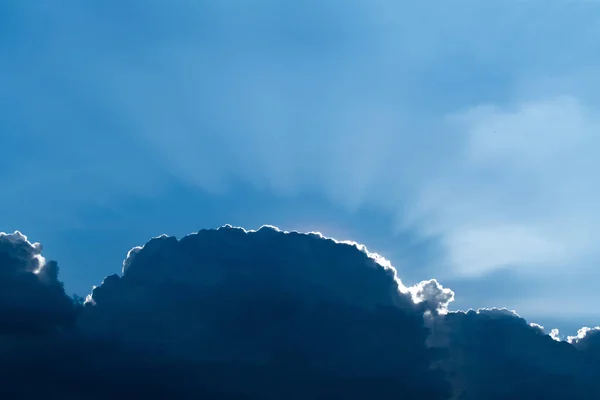 Sun rays through clouds like an dramatic explosion , power natur