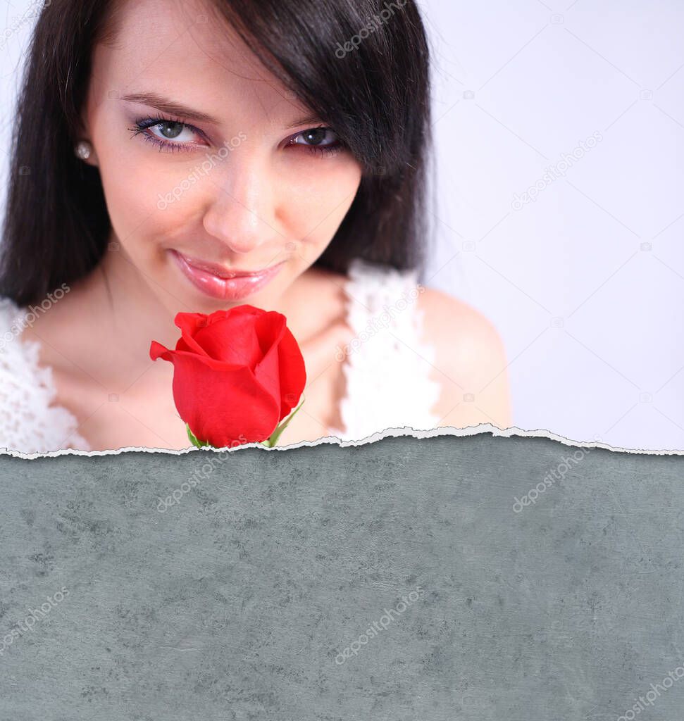 Sexy woman holding a red rose