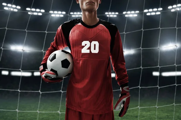 Soccer goalkeeper holding soccer ball